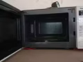 微波爐一個七八成新的，正常使用，自取
